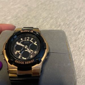 Black and gold Baby G shock watch barely used.In perfect condition.Needs battery